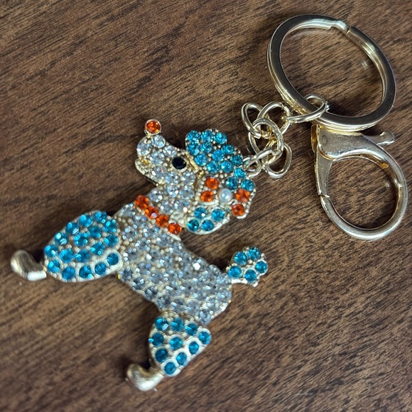 Sparkling poodle dog Keychain with blue orange Accents - Picture 1 of 5
